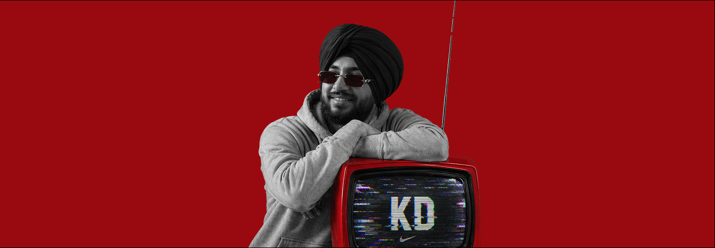 Karandeep Singh leaning on a retro monitor